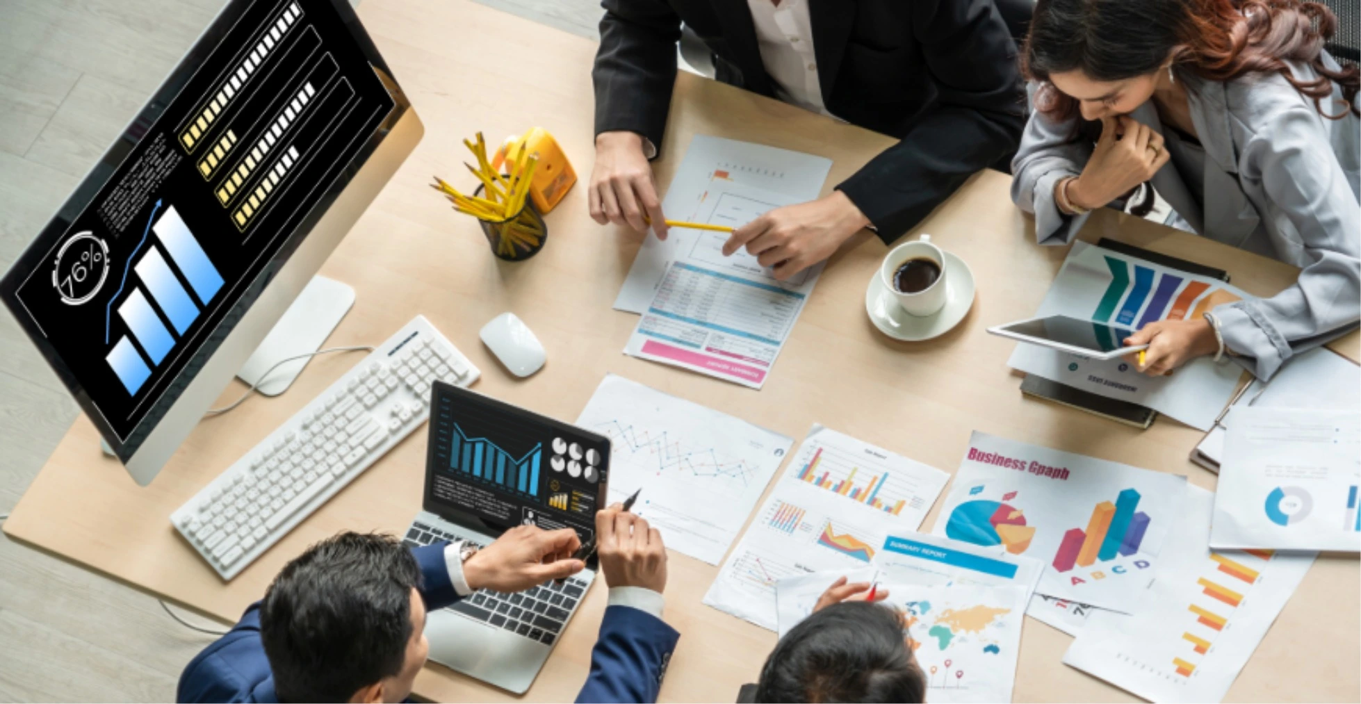 Professional HR services in UAE team conducting strategy meeting and data analysis to support Europeans and Indians with employee management, compliance, and business growth in Dubai