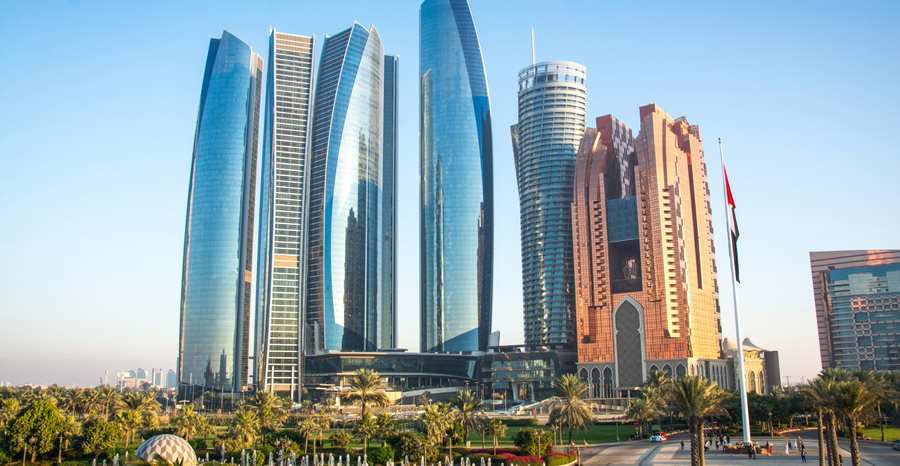 Modern skyscrapers of the Etihad Towers skyline in Abu Dhabi representing corporate growth and business compliance through ISO Certification Services in the UAE.